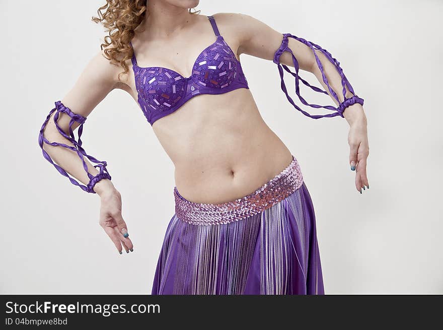 Beautiful woman in the active, arabic dance, studio shot