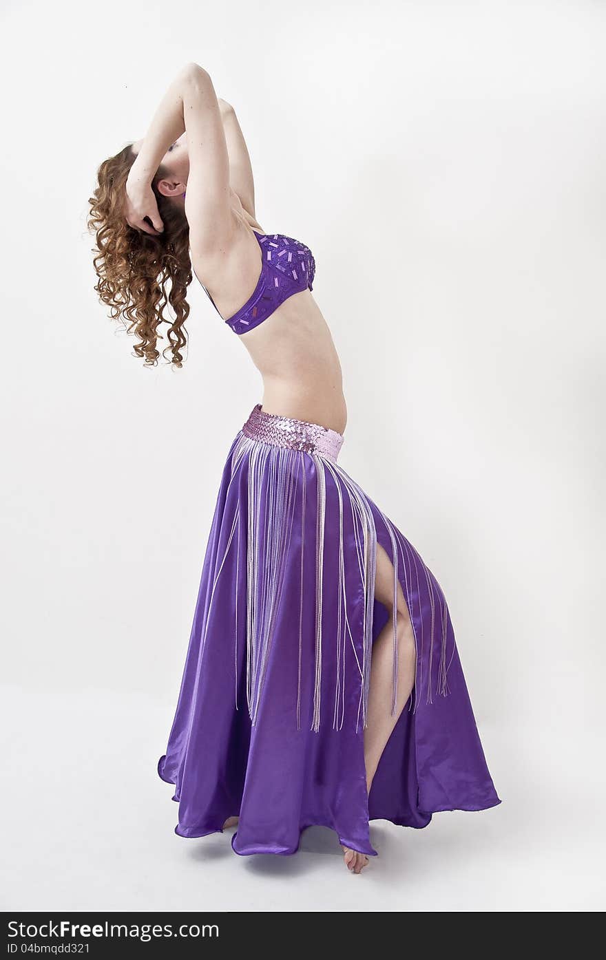 Beautiful woman in the active, arabic dance, studio shot