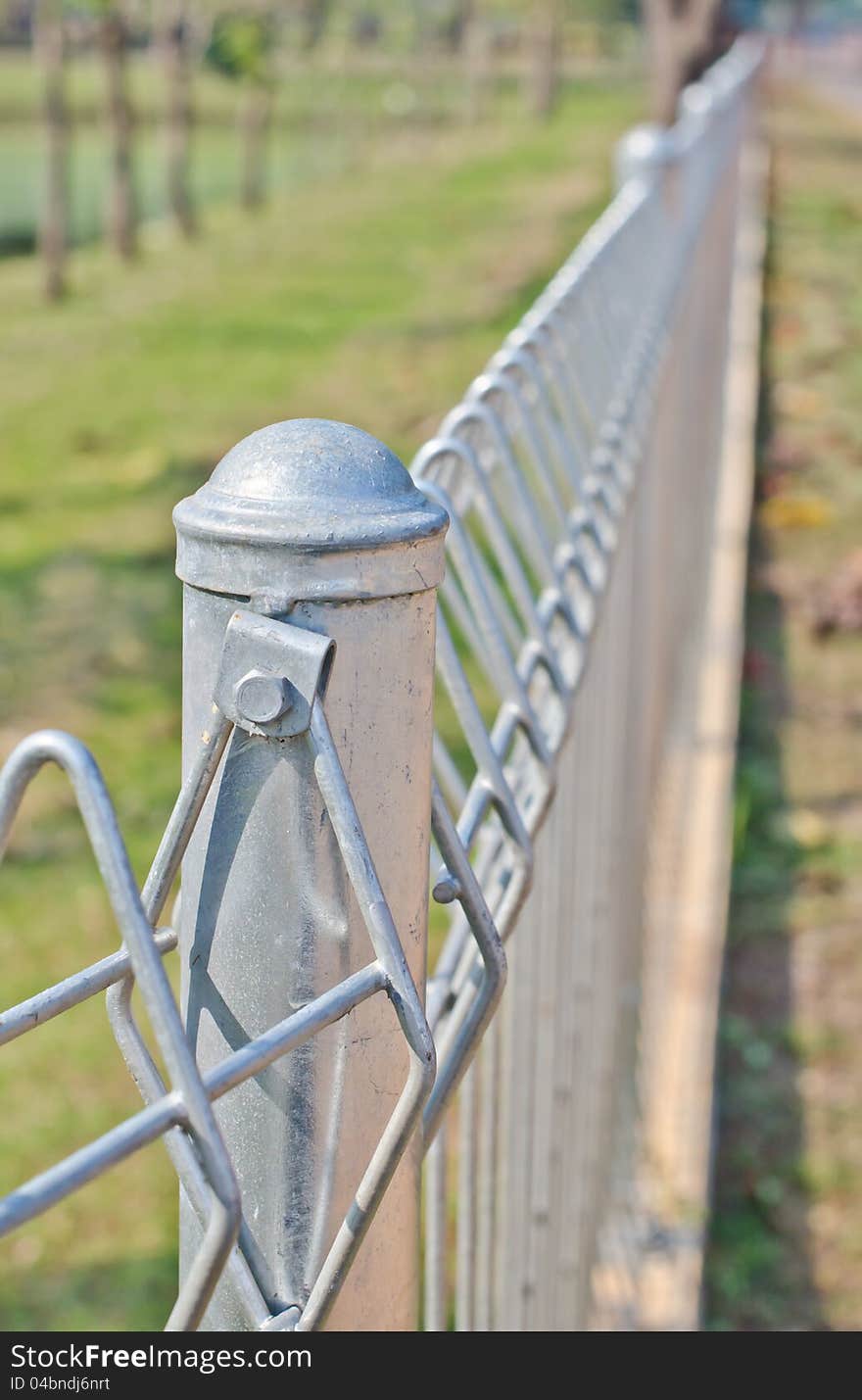 Fence made ​​of steel in the town. Fence made ​​of steel in the town.