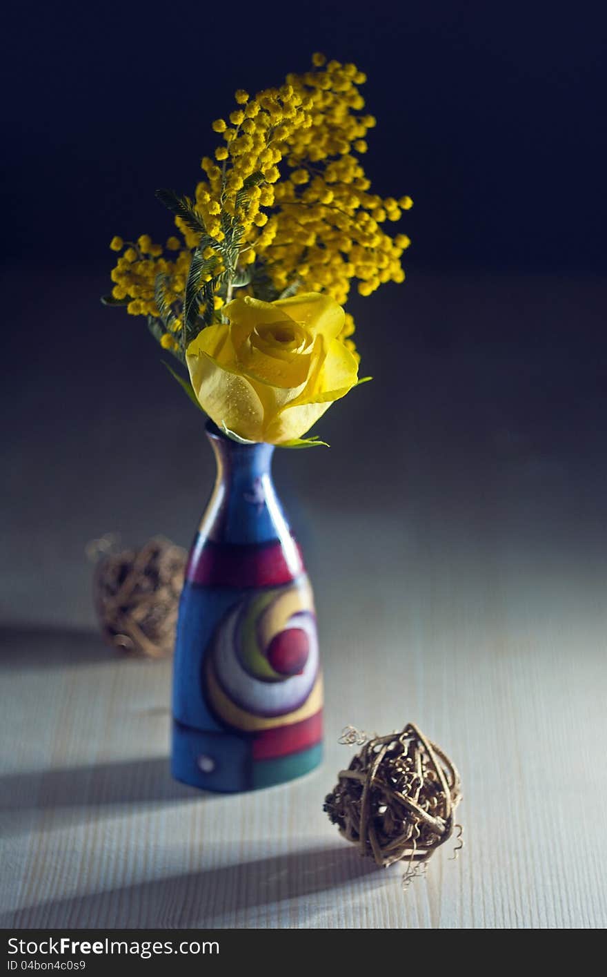 Ranunculus in colore vase with mimosa. Ranunculus in colore vase with mimosa