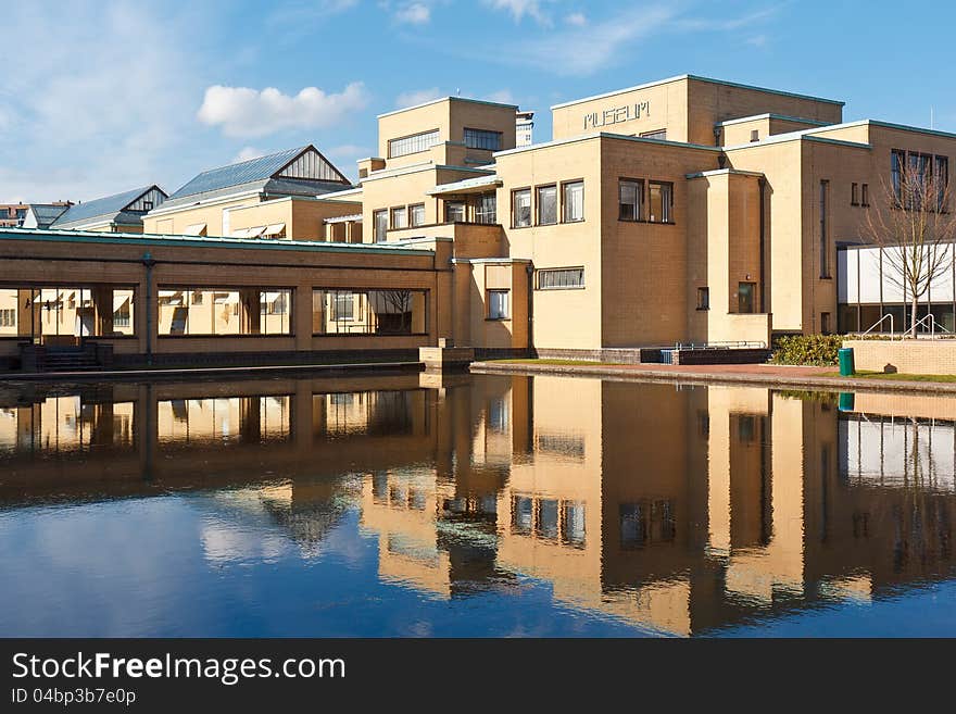 Reflection Yellow Brick Municipality Museum on the water of the pool, The Hague, Netherlands. Reflection Yellow Brick Municipality Museum on the water of the pool, The Hague, Netherlands