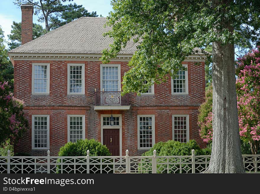 Colonial house in Williamsburg Virginia with white fence. Colonial house in Williamsburg Virginia with white fence