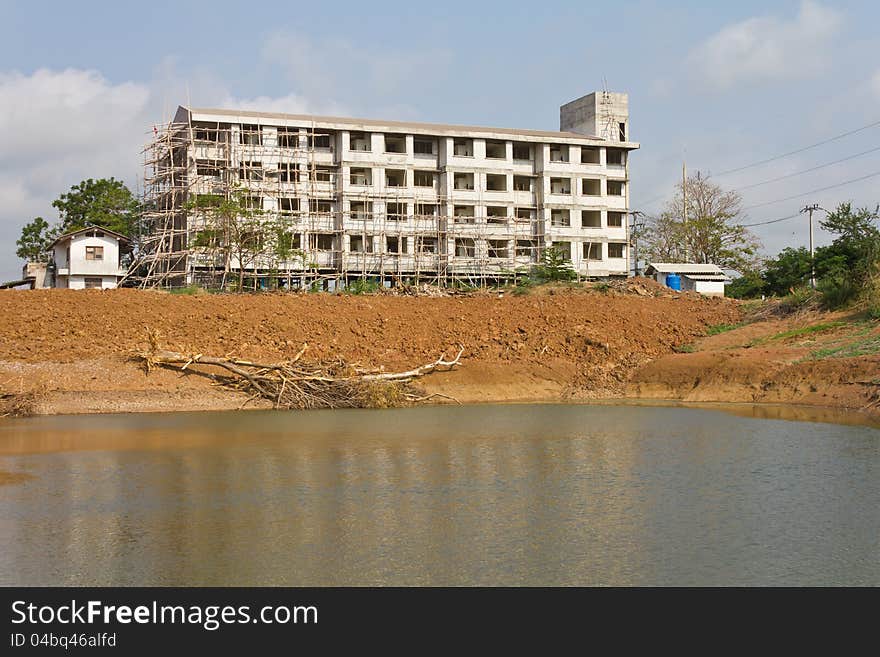 Many buildings on the pond.