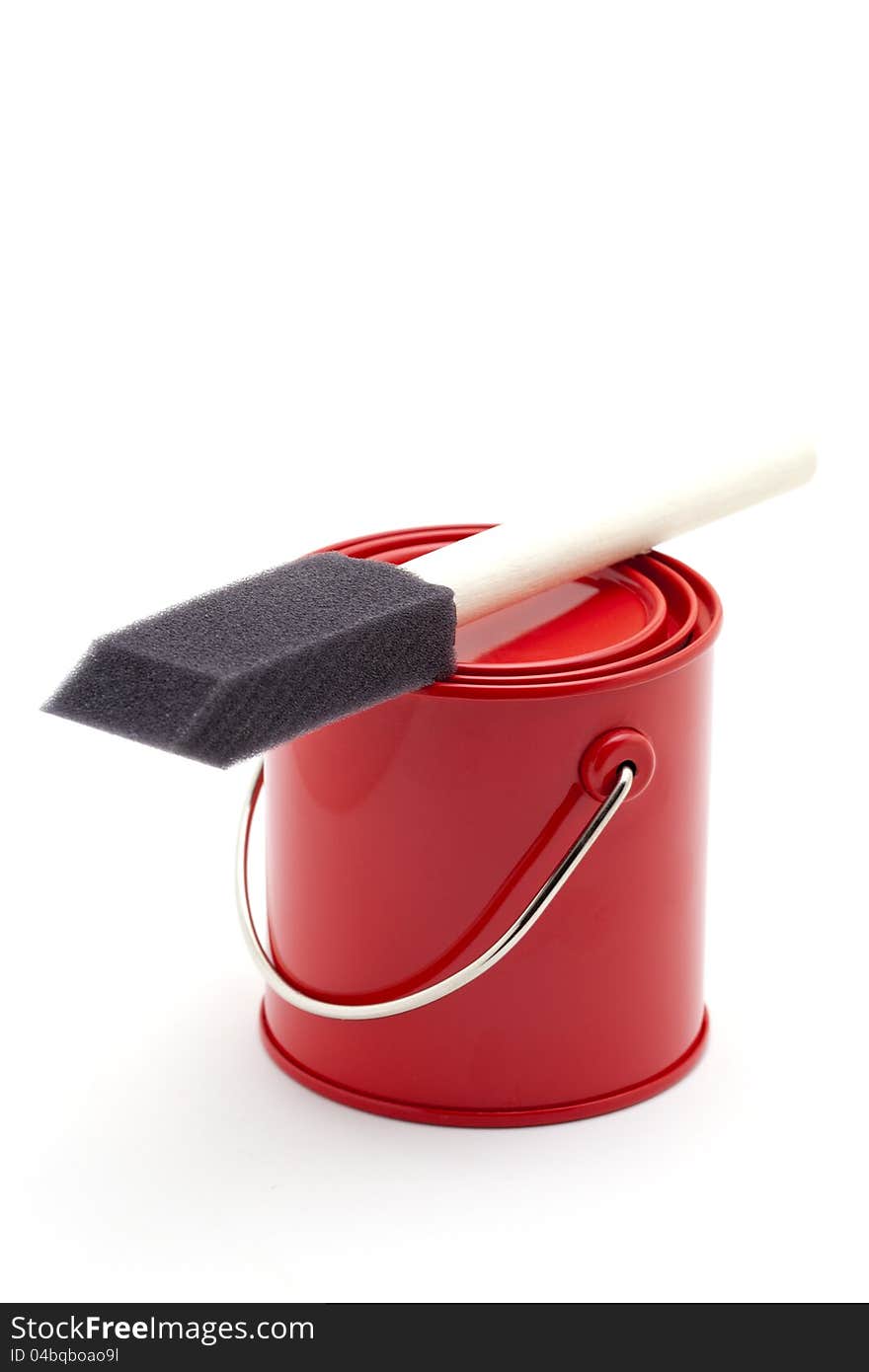 Red paint bucket and brush, on white background