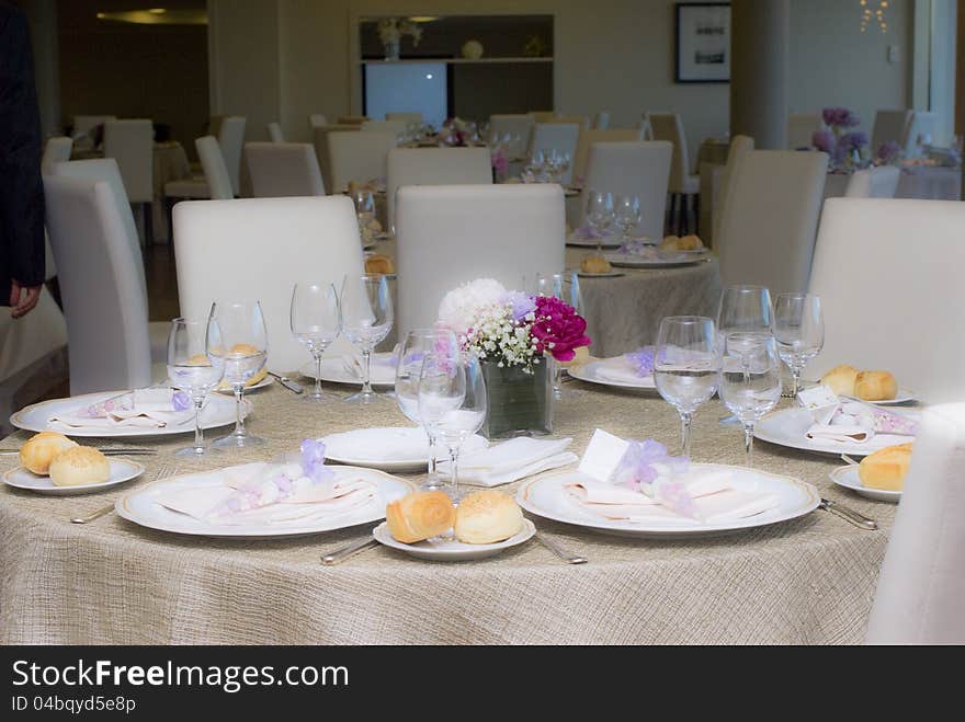 A wedding table with flowers and petals