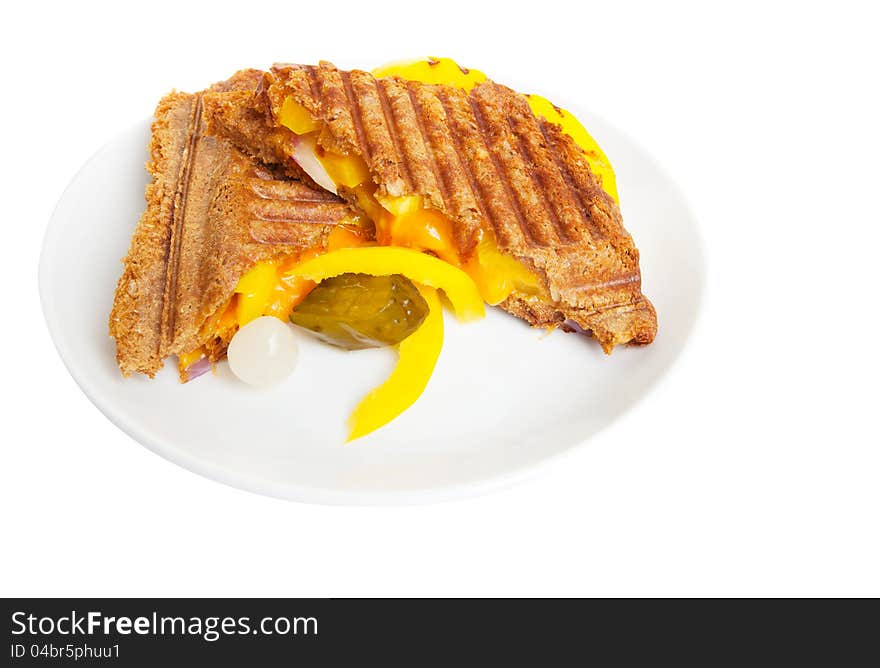 Grilled sandwich or panini with melting cheese,peppers, and  onions, on wholewheat bread.