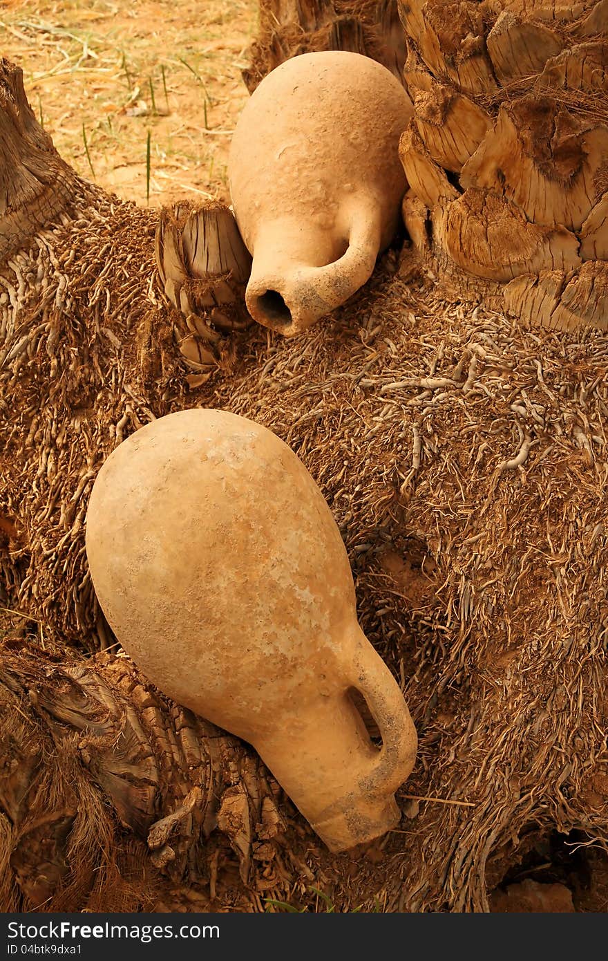 Two disposed of clay jars, morocco, village