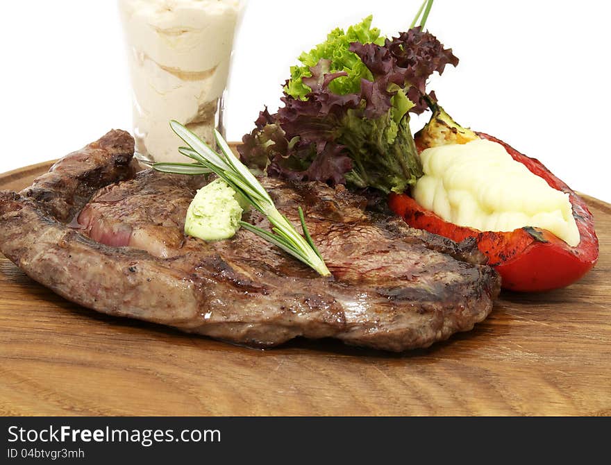 Steak and mashed potatoes with gravy on a white background. Steak and mashed potatoes with gravy on a white background