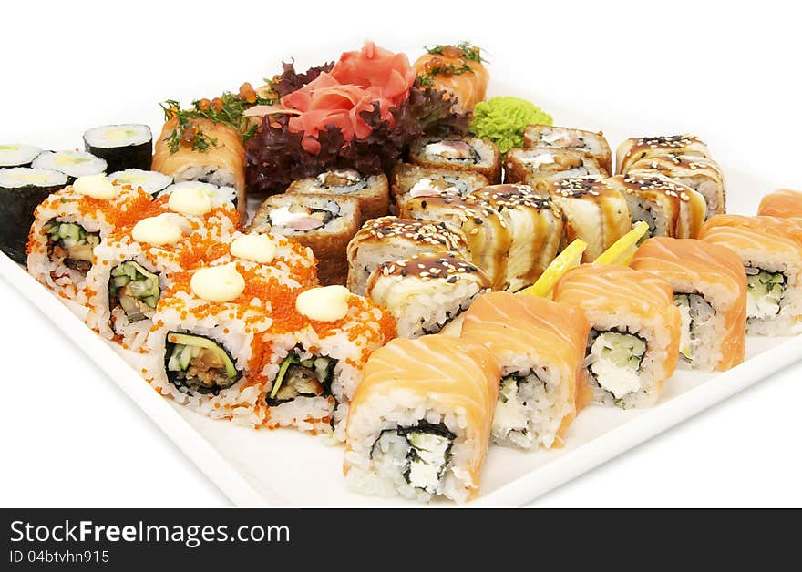 A huge plate of sushi on white background