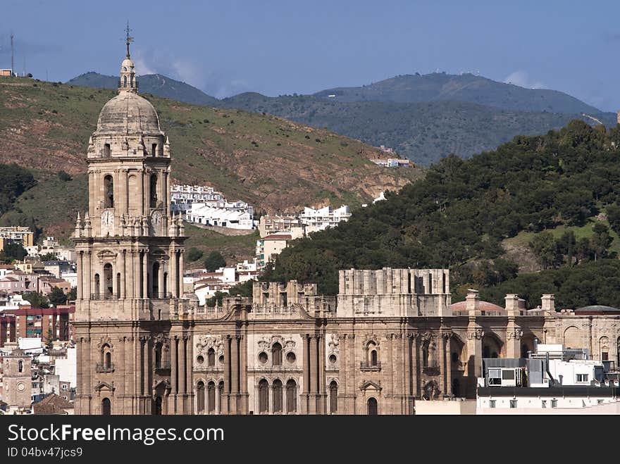 Views of Malaga cathedral with mountains in the background. Views of Malaga cathedral with mountains in the background