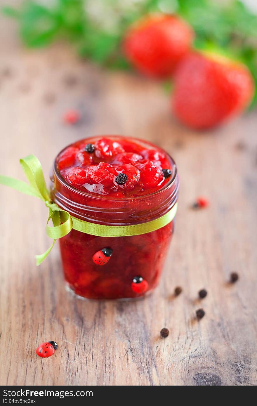 Strawberry and pepper jam, selective focus