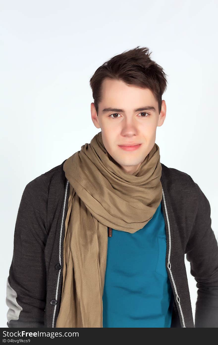 Beautiful young man in blue tanktop pose on white background