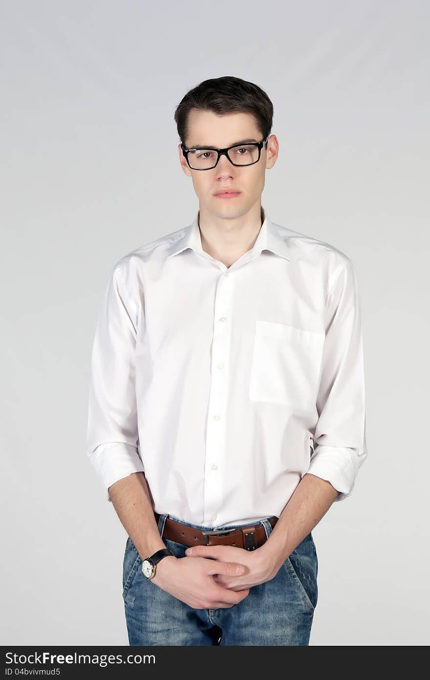 Young man wearing glasses on white background