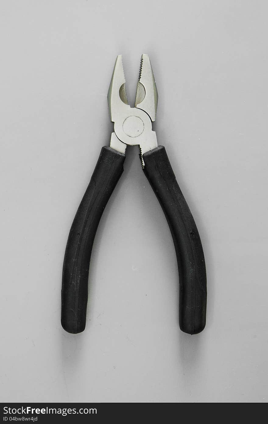 Pliers  on white with black handle