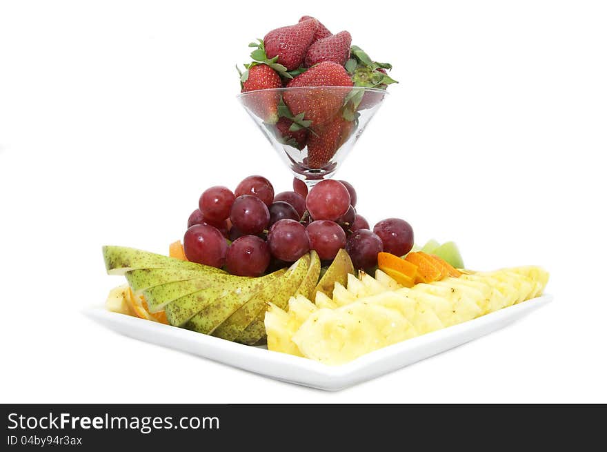 Dish with a fruity dessert on a white background