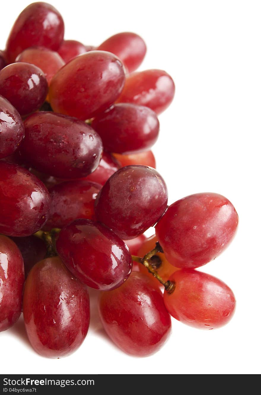 Red seedless grapes on a white background. Red seedless grapes on a white background