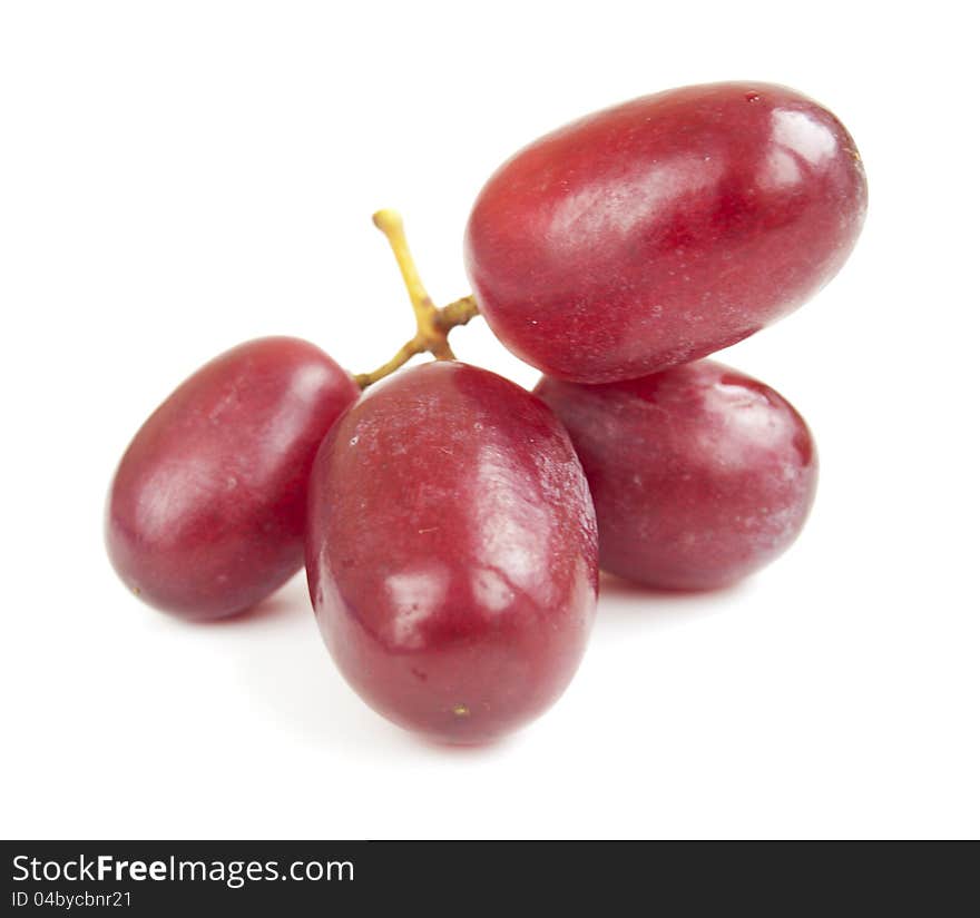 Red seedless grapes on a white background. Red seedless grapes on a white background