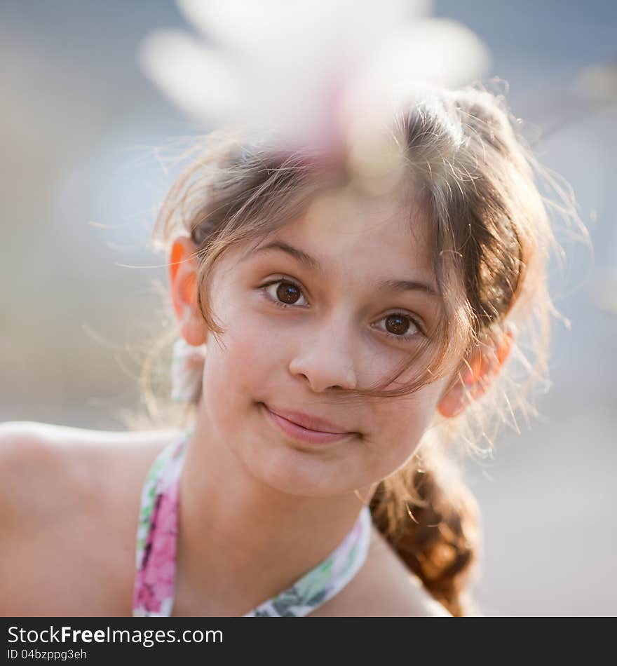 Pretty young girl looks at camera