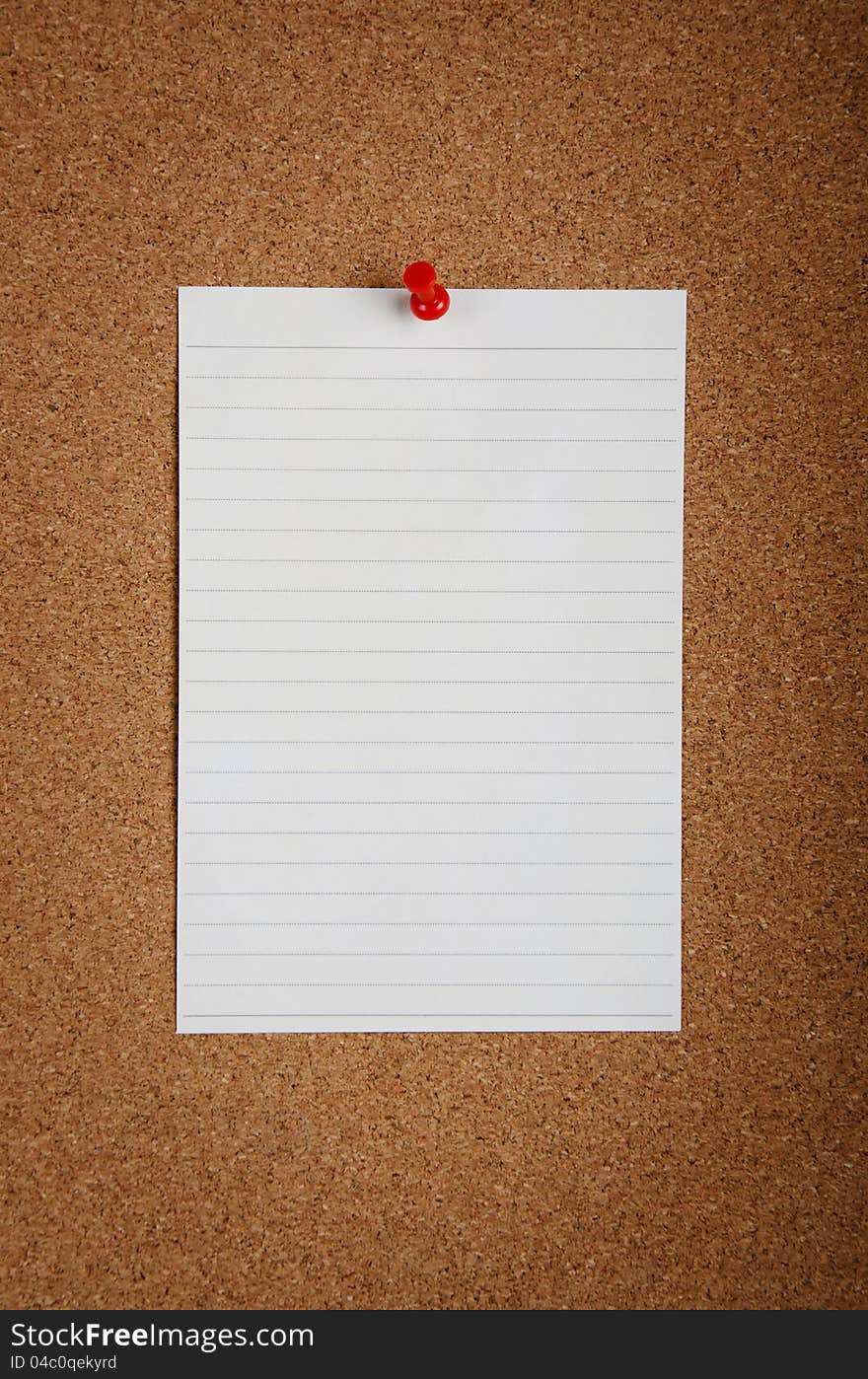 A note pad sticked on bulletin board