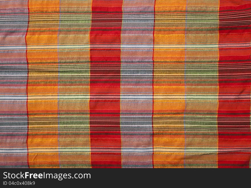 Close-up of multicoloured fabric with geometric pattern