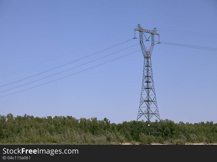 Power transmission tower against blue sky. Power transmission tower against blue sky