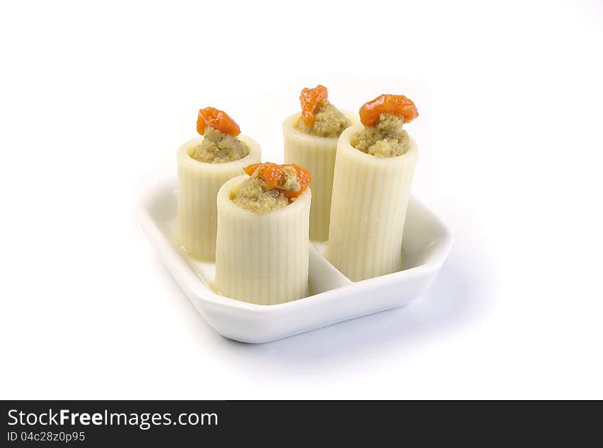 Aperitif in the ceramic plates on a white background