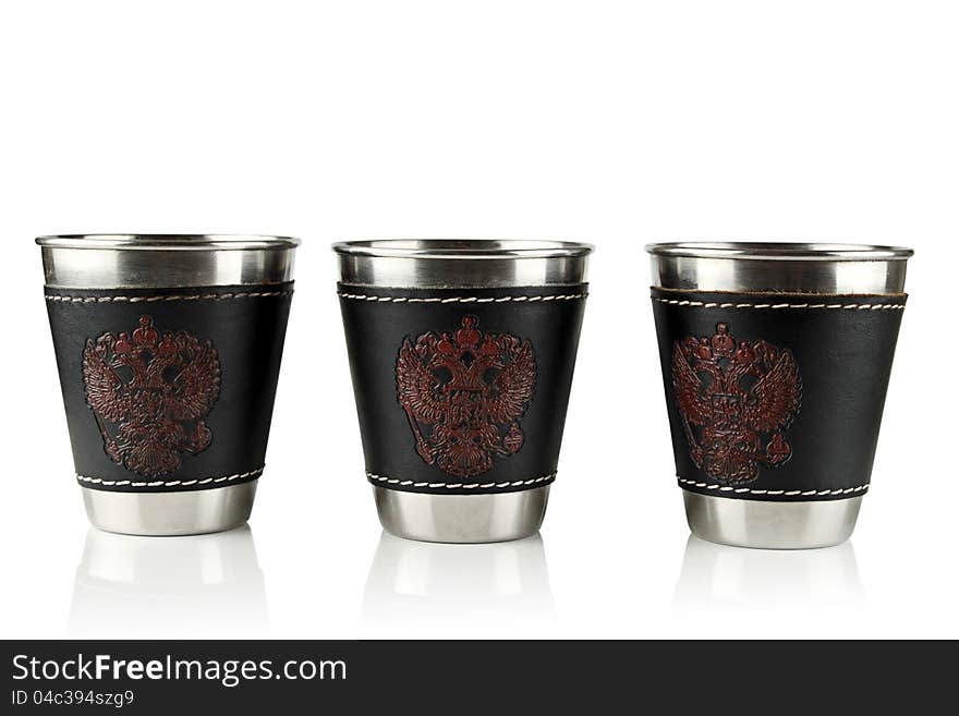 Three metal cups for drinking on a white background. Three metal cups for drinking on a white background.