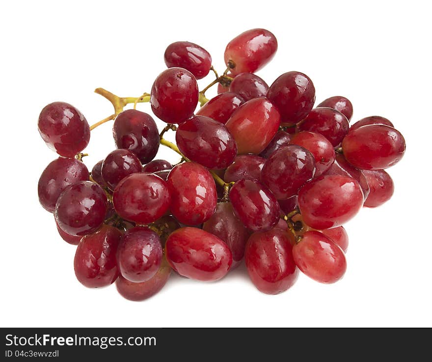 Red seedless grapes on a white background. Red seedless grapes on a white background