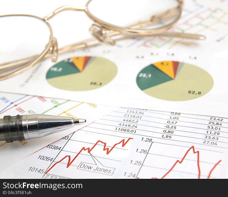 Chart with glasses and pen. Chart with glasses and pen