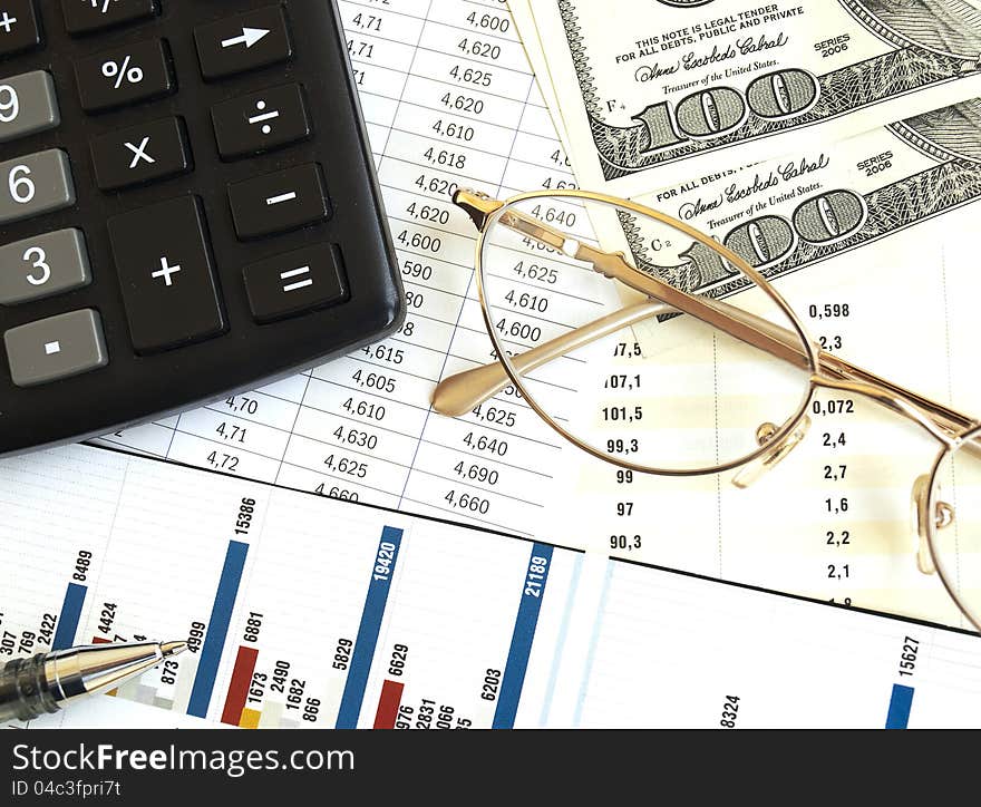 Chart with calculator, glass and pen. Chart with calculator, glass and pen