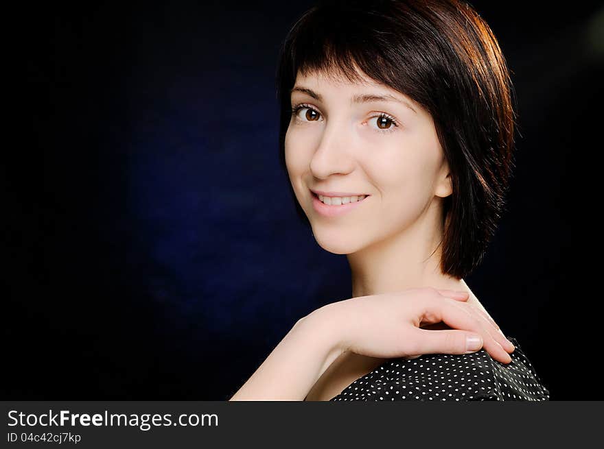 Portrait of beautiful young woman in polka-dot dress