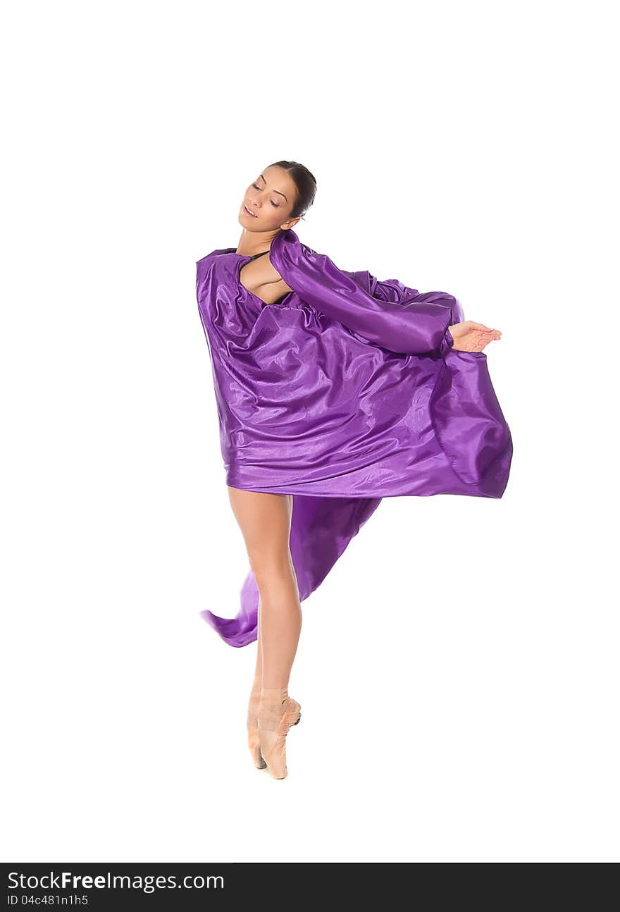 Ballet dancer in purple fabric isolated on white background. Ballet dancer in purple fabric isolated on white background