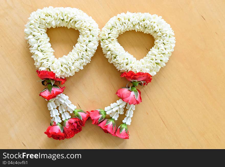 Close up top view pair of thai style garland on wood background