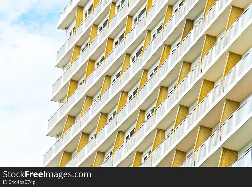 Part of building facade pattern with cloud sky. Part of building facade pattern with cloud sky