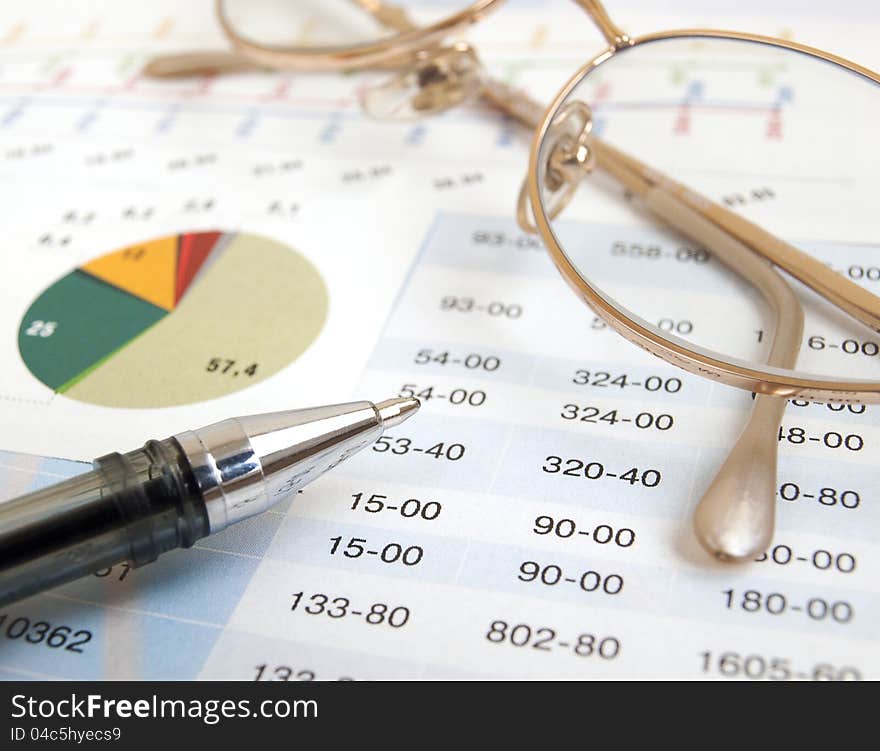 Chart with glasses and pen. Chart with glasses and pen
