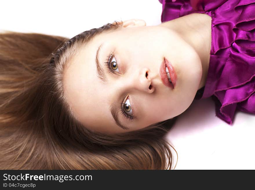 Closeup portrait of sexsual young woman posing while lying on floor. Closeup portrait of sexsual young woman posing while lying on floor