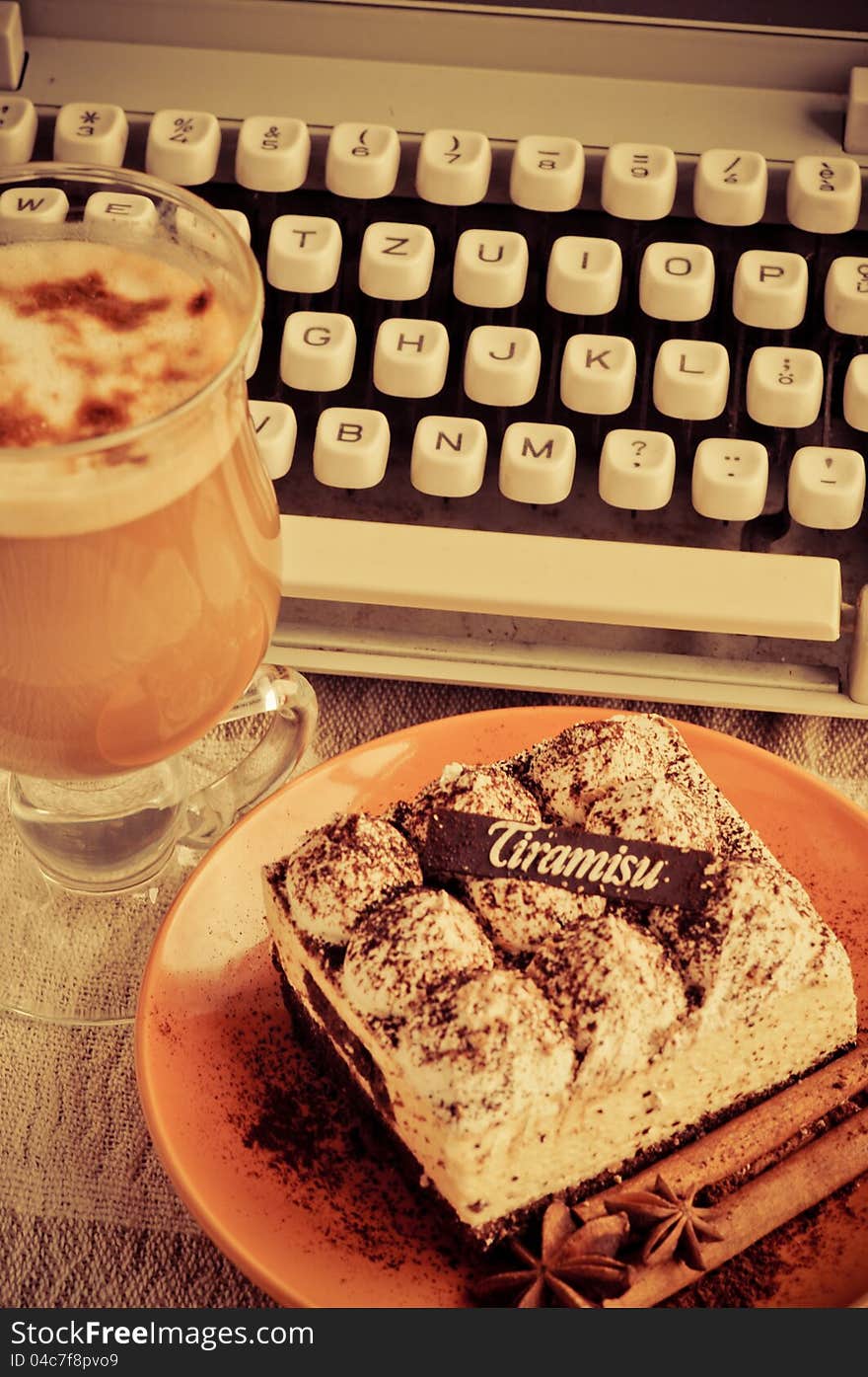 Classic tiramisu with stick of cinnamon and stars of anise on a plate. Classic tiramisu with stick of cinnamon and stars of anise on a plate