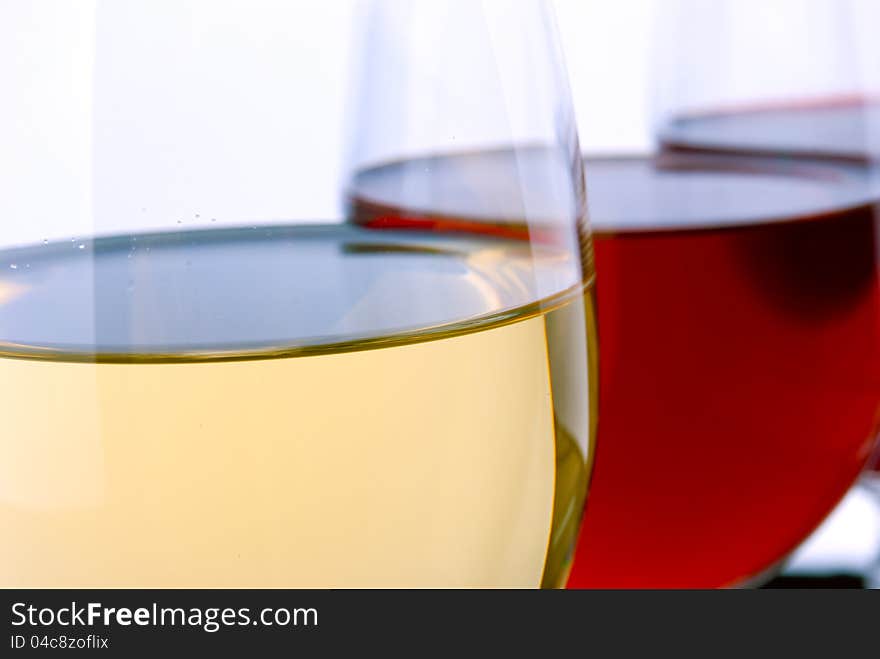 Glasses with wine on a white background