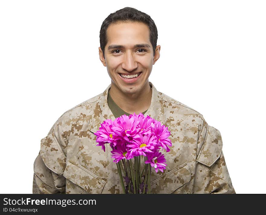 Latino Serviceman holding some flowe. Latino Serviceman holding some flowe