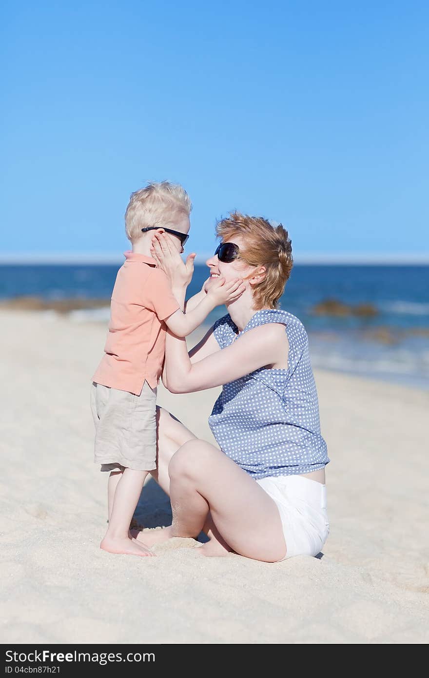 Mother And Son Together At The Beach