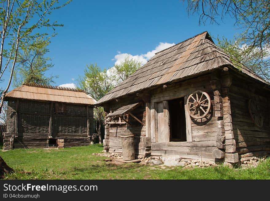 Old traditional wooden house in Romanian rural area in sunny day. Old traditional wooden house in Romanian rural area in sunny day