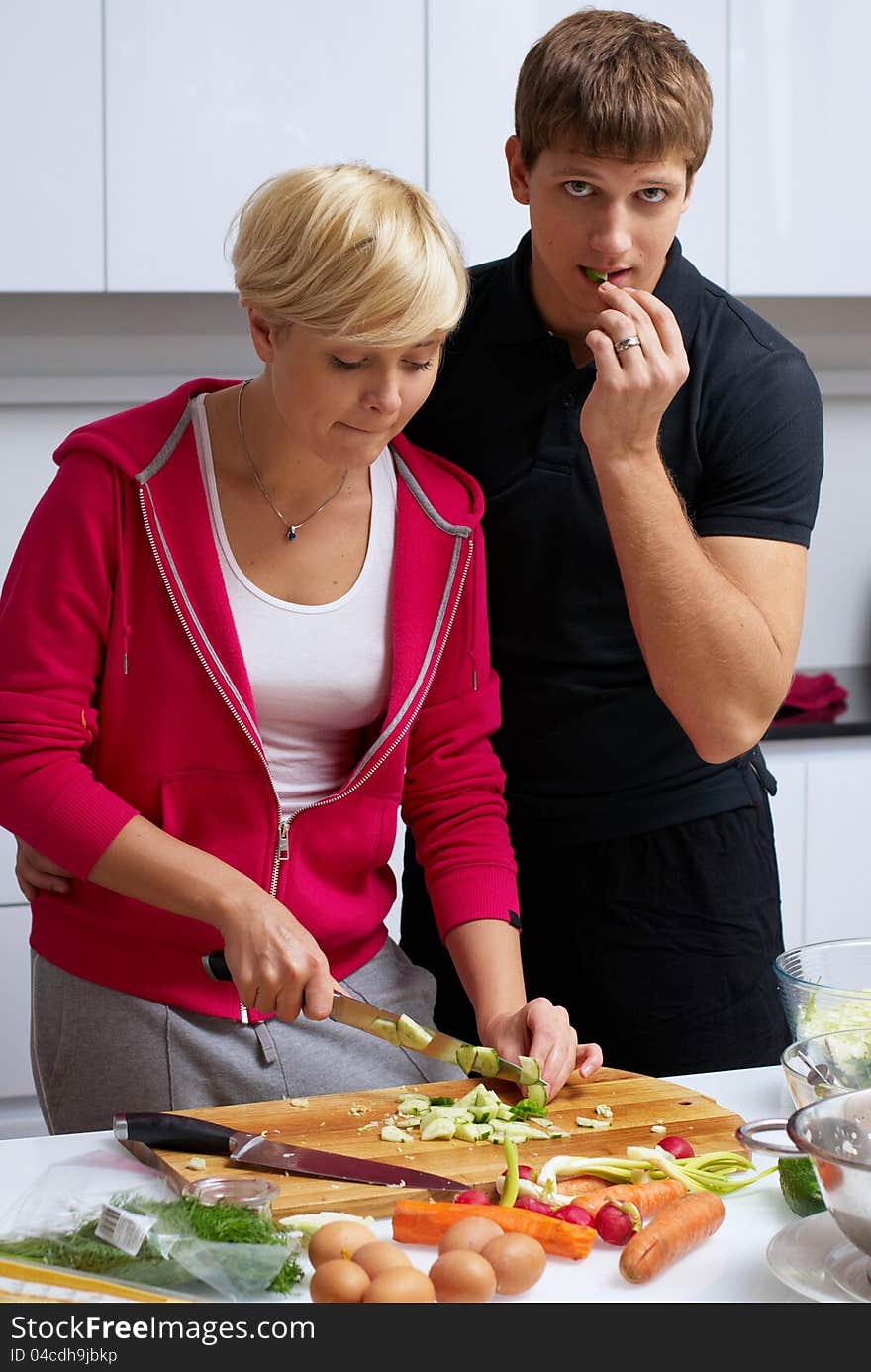 Lovely couple making a salad