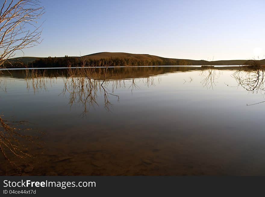 Lake with a hill in the background. Lake with a hill in the background