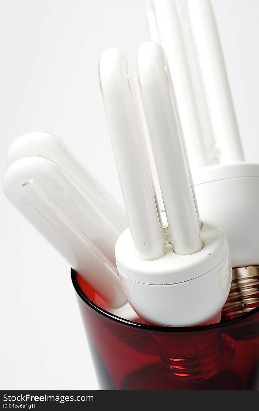 Light bulbs in red glass close up. Light bulbs in red glass close up