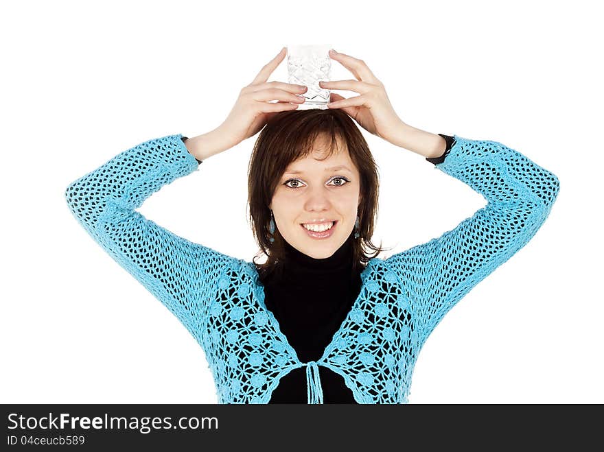 Beautiful girl holds on the head with a glass of water. Beautiful girl holds on the head with a glass of water