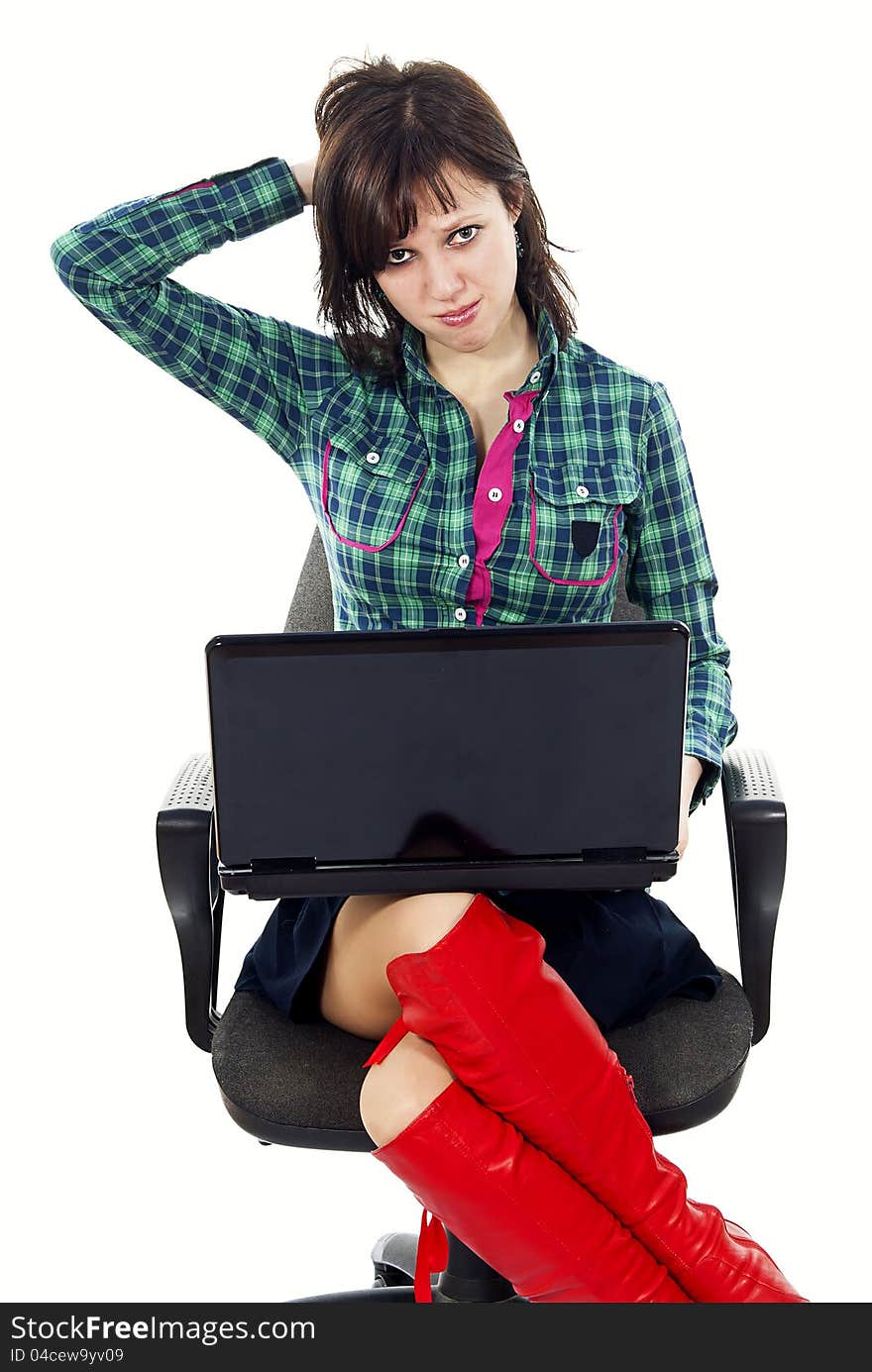 Beautiful girl on the couch with a laptop