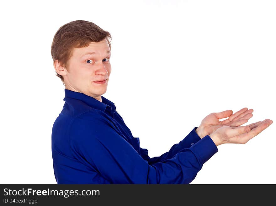 Handsome guy in the blue shirt stretches out his hand. Handsome guy in the blue shirt stretches out his hand