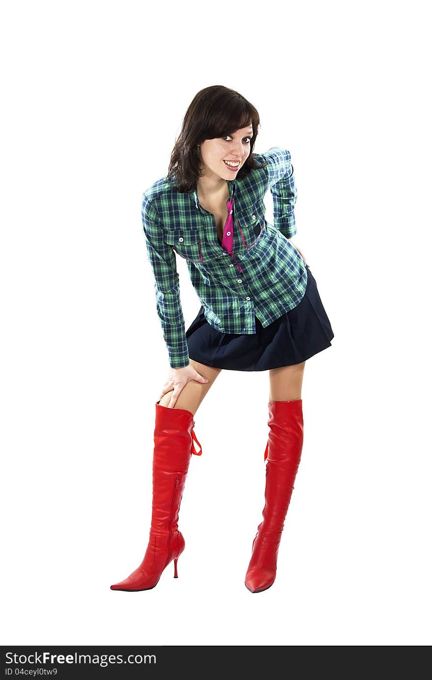 Beautiful girl standing in the red boots isolated