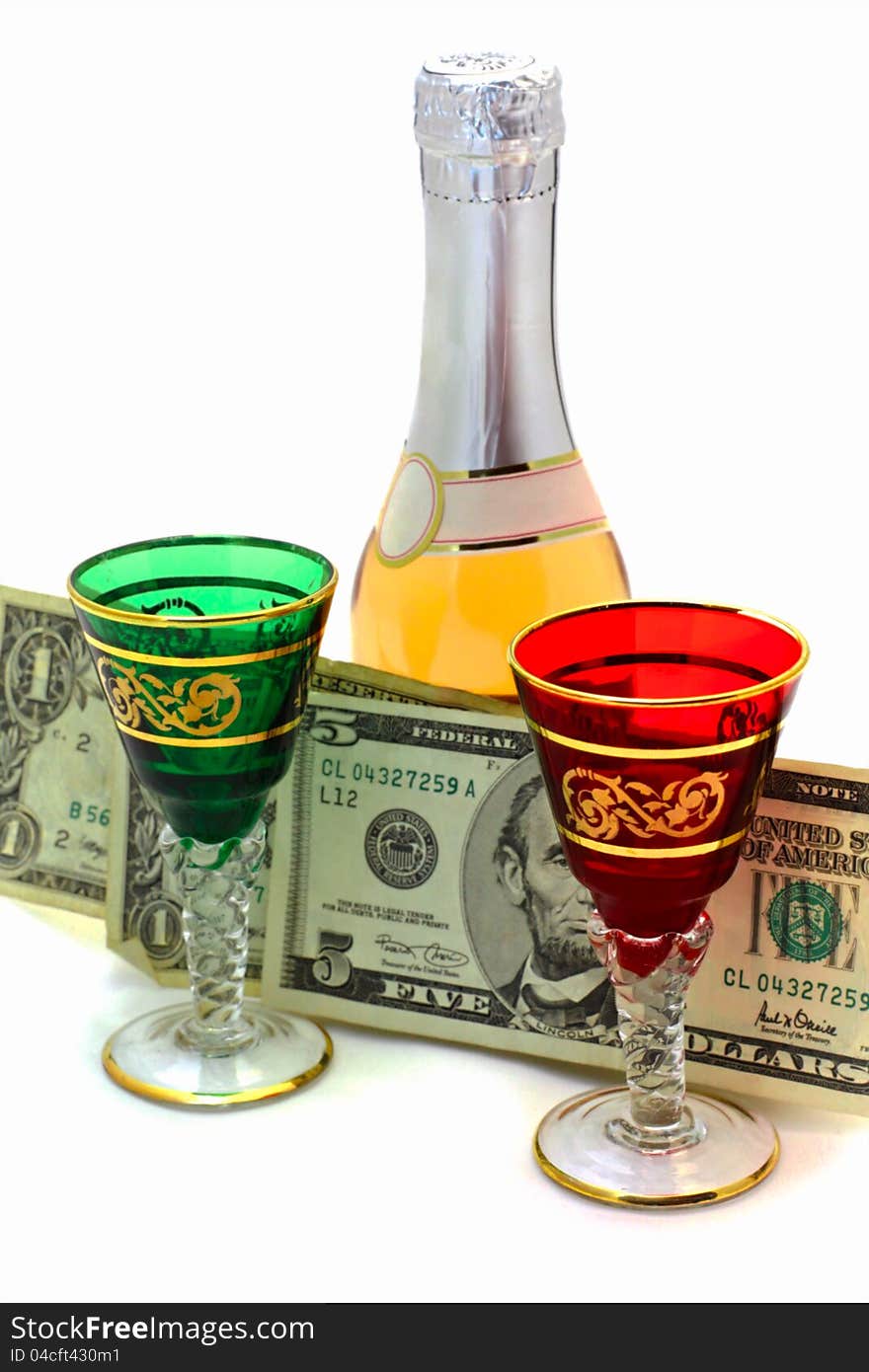 Wine-glasses wine and dollars on a white background. Wine-glasses wine and dollars on a white background