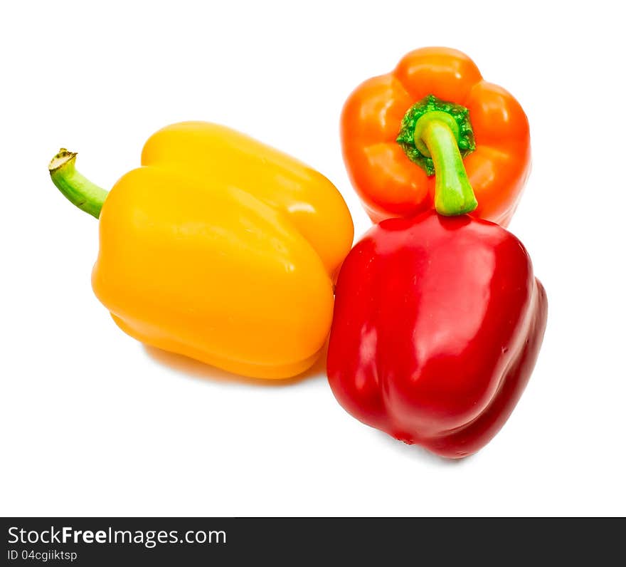 Red, yellow, orange Bulgarian pepper on white background